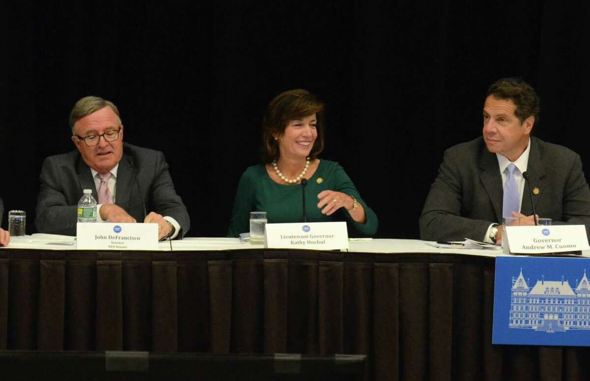 From left to right, Sen. John DeFrancisco, Lt. Gov. Kathy Hochul, and Gov. Andrew Cuomo participate in "Capital for a Day," at the Holiday Inn in Liverpool, suburban Syracuse, N.Y, Wednesday, Sept. 30, 2015. (David Lassman /The Syracuse Newspapers via AP)
