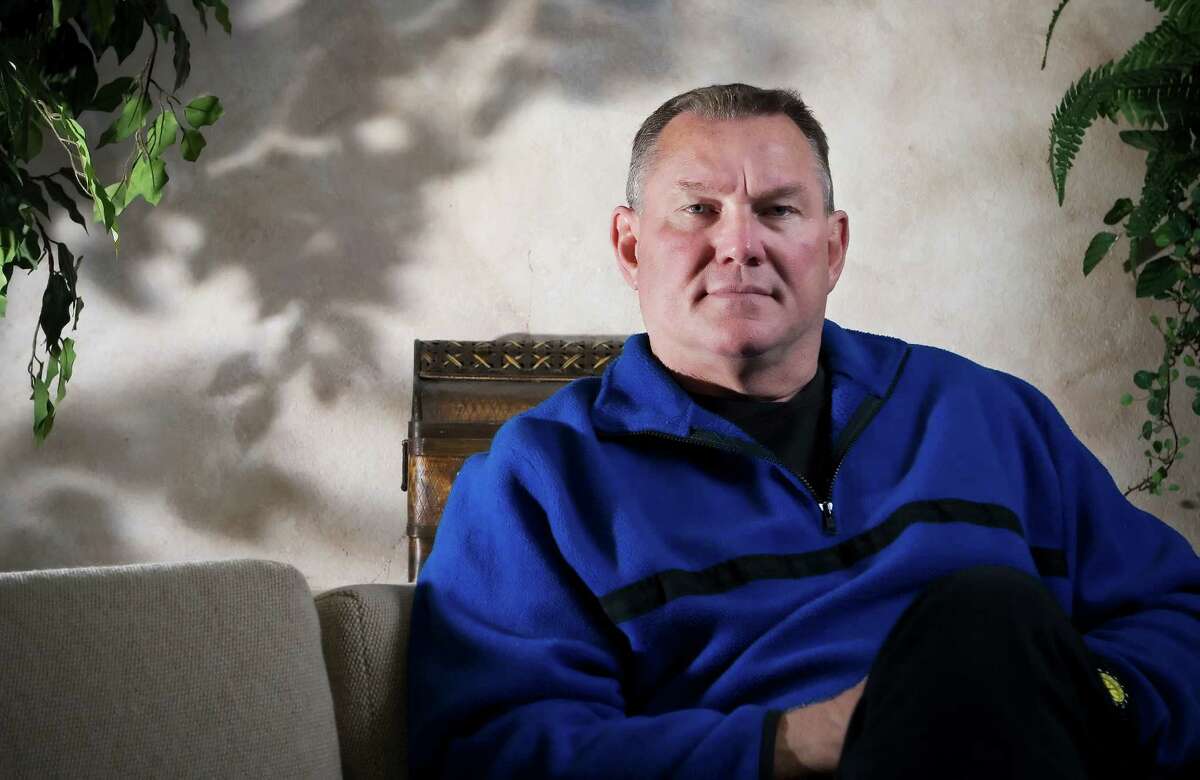 Former Oiler Mike Barber poses for a portrait at his office Friday morning. Barber now minsters to prisoners nationwide. Barber played for Houston's beloved 1979 Oilers football team. Special to the Houston Chronicle/Brandon Wade Dec. 7, 2007.