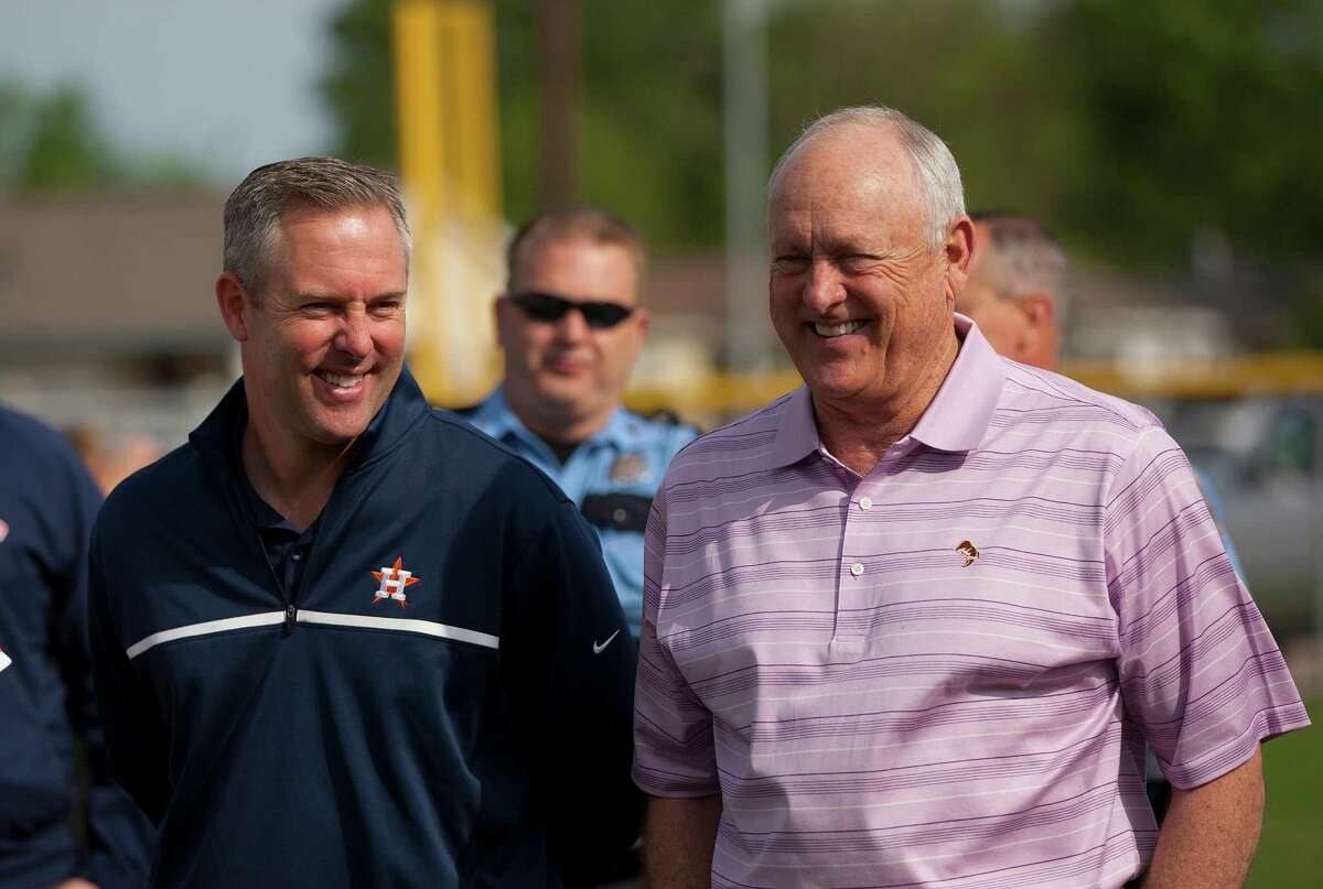 Astros President of Business Operations Reid Ryan and his father and Astros Executive Advisor Nolan Ryan share a laugh at the newly revitalized youth baseball fields at Denver Harbor Park Saturday, April 5, 2014, in Houston. The new fields were brought back to life with the help of The Astros Foundation with support from the Occidental Petroleum Corporation. The Astros Community Leaders program is investing $18 million in city-owned public youth baseball and softball fields in disadvantaged areas of Houston over the course of five years. ( Johnny Hanson / Houston Chronicle )