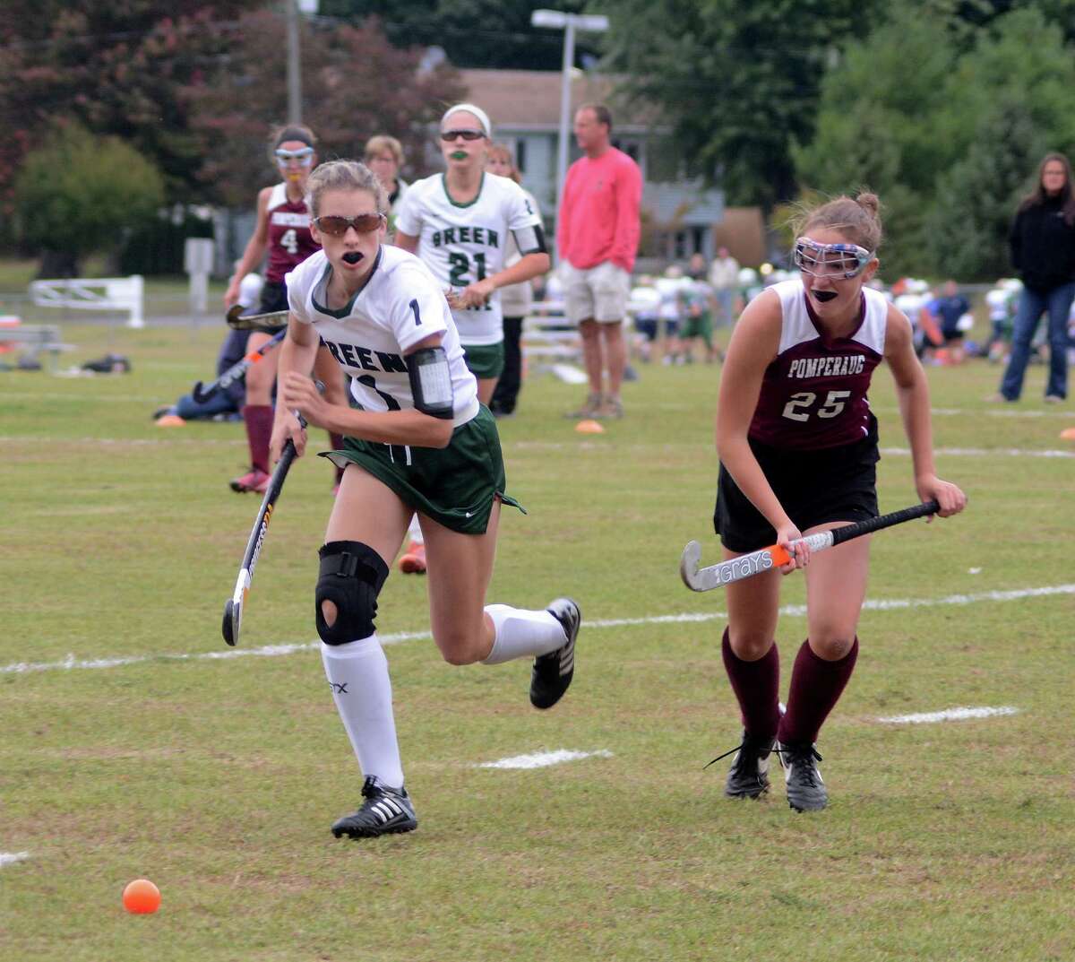 New Milfords Micheala Ferlow, left, and Pomperaugs Allison McCormick rush to gain possession during a game at New Milford on Thursday, Ocotber 1, 2015.