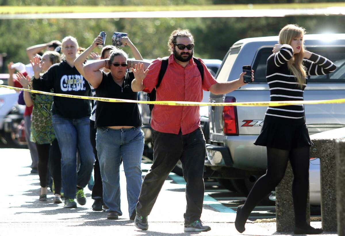 Students, staff and faculty are evacuated from Umpqua Community College in Roseburg, Ore. after a deadly shooting Thursday.﻿