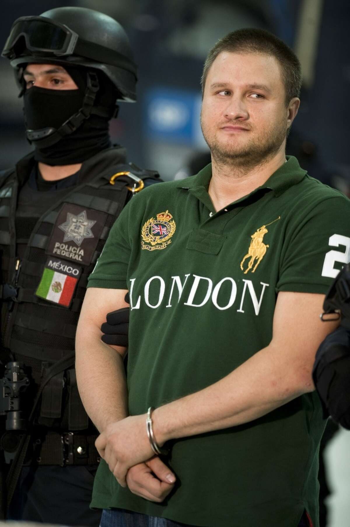 Edgar Valdez Villareal aka 'La Barbie' of the Beltran Leyva drug cartel, is presented to the press at the Federal Police headquarters in Mexico City, on August 31, 2010. Mexican authorities on Monday announced the capture of one of the country's most sought after drug kingpins, US-born Valdez Villarreal, known as 'the Barbie' for his fair complexion. Valdez was detained in a police operation in central Mexico, following intelligence work which began in June 2009. The 37-year-old was a key lieutenant of Arturo Beltran Leyva, who headed the cartel that bears his name and was Mexico's third most-wanted man until his December 2009 death in a military operation. AFP PHOTO/Alfredo Estrella (Photo credit should read ALFREDO ESTRELLA/AFP/Getty Images)