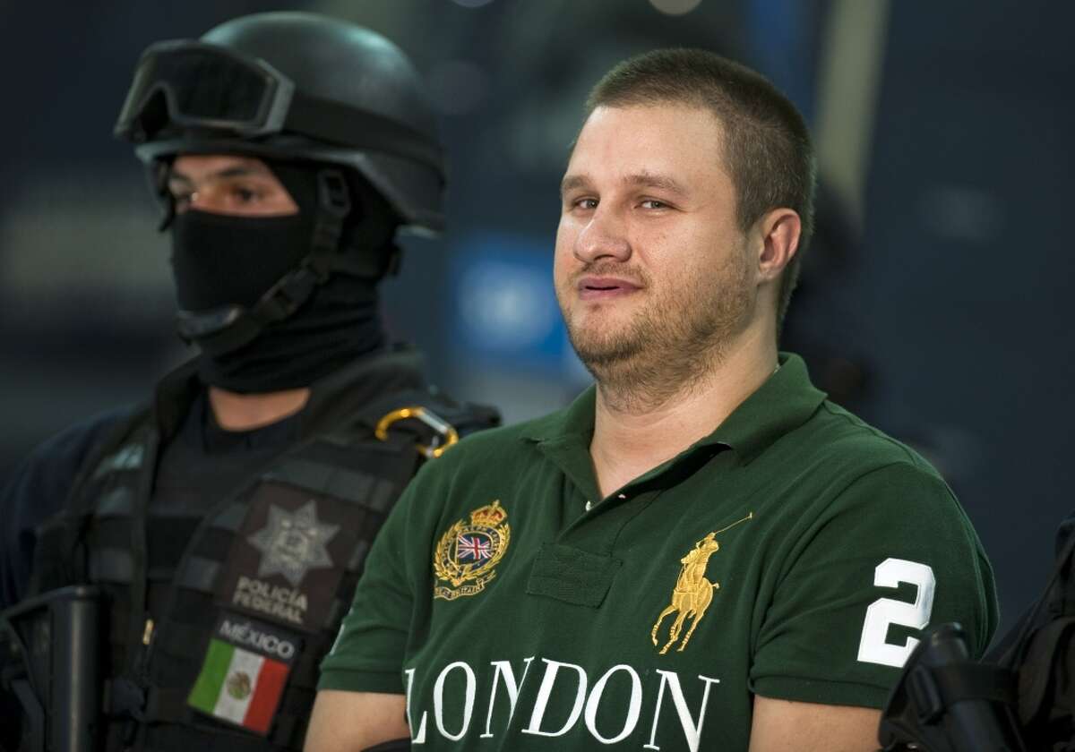 FILE - Edgar Valdez Villareal aka "La Barbie", of the Beltran Leyva drug cartel, is presented to the press at the Federal Police headquarters in Mexico City, on August 31, 2010. US-born Valdez Villarreal was extradited to the US alongside 12 other criminals, the Mexican General Attorney's office announced on September 30, 2015. The 37-year-old was a key lieutenant of Arturo Beltran Leyva, who headed the cartel that bears his name. AFP PHOTO/Alfredo EstrellaALFREDO ESTRELLA/AFP/Getty Images