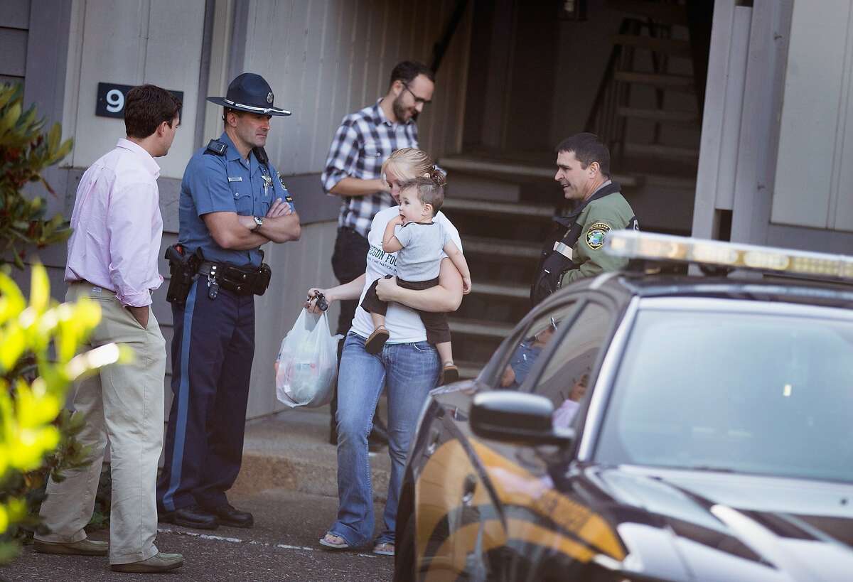 Police stand watch outside the apartment where 26-year-old Chris Harper Mercer lived on October 2, 2015 in Winchester, Oregon. Yesterday Mercer went on a shooting rampage at Umpqua Community College, killing nine people and wounding another seven before he was killed. After Mercer's death police found six guns and a flak jacket at the school and another seven guns in his home.