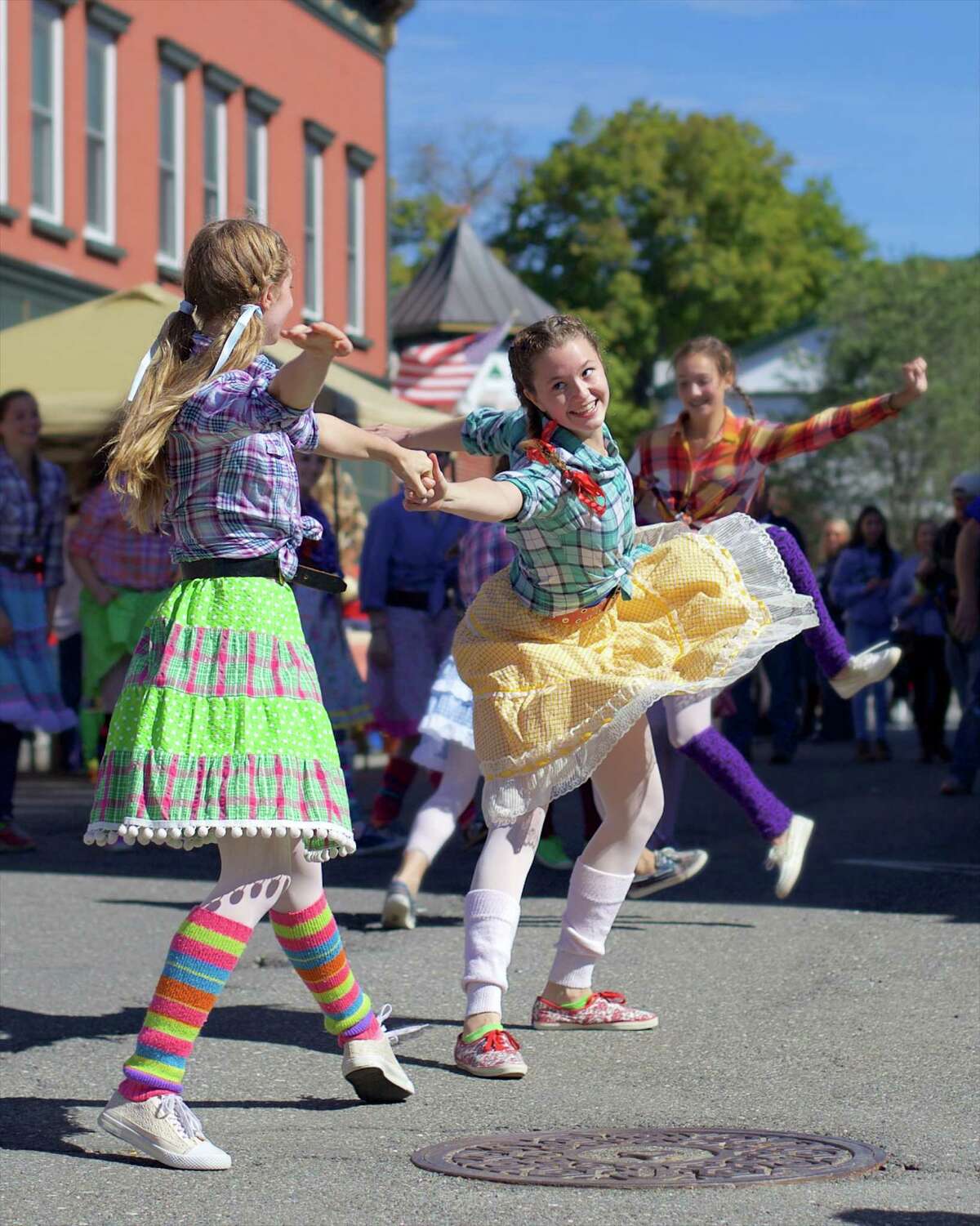 The Greater New Milford Chamber of Commerce hosted the seventh annual Harvest Festival on Sunday, October 4th, 2015, in downtown New Milford. Dancers from AIM (Artists in Motion), in residence at Fineline, took on Bank Street to entertain the crowd. Here, Kiah Liotta and Elena Harcken pair up during a fun hoedown dance on Bank Street.