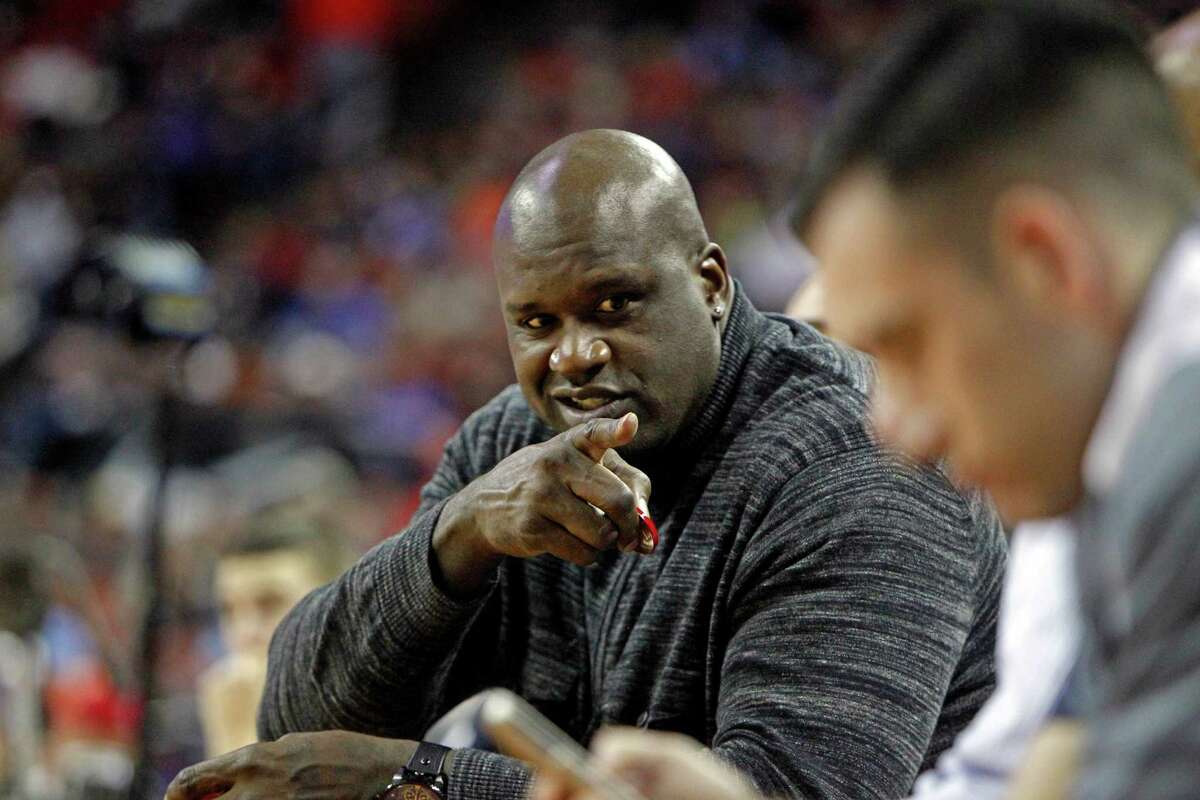 Former NBA player Shaquille O’Neal watches the UIL Class 5A state basketball final between Galena Park North Shore and Converse Judson, Saturday, March 8, 2014, in Austin, Texas.
