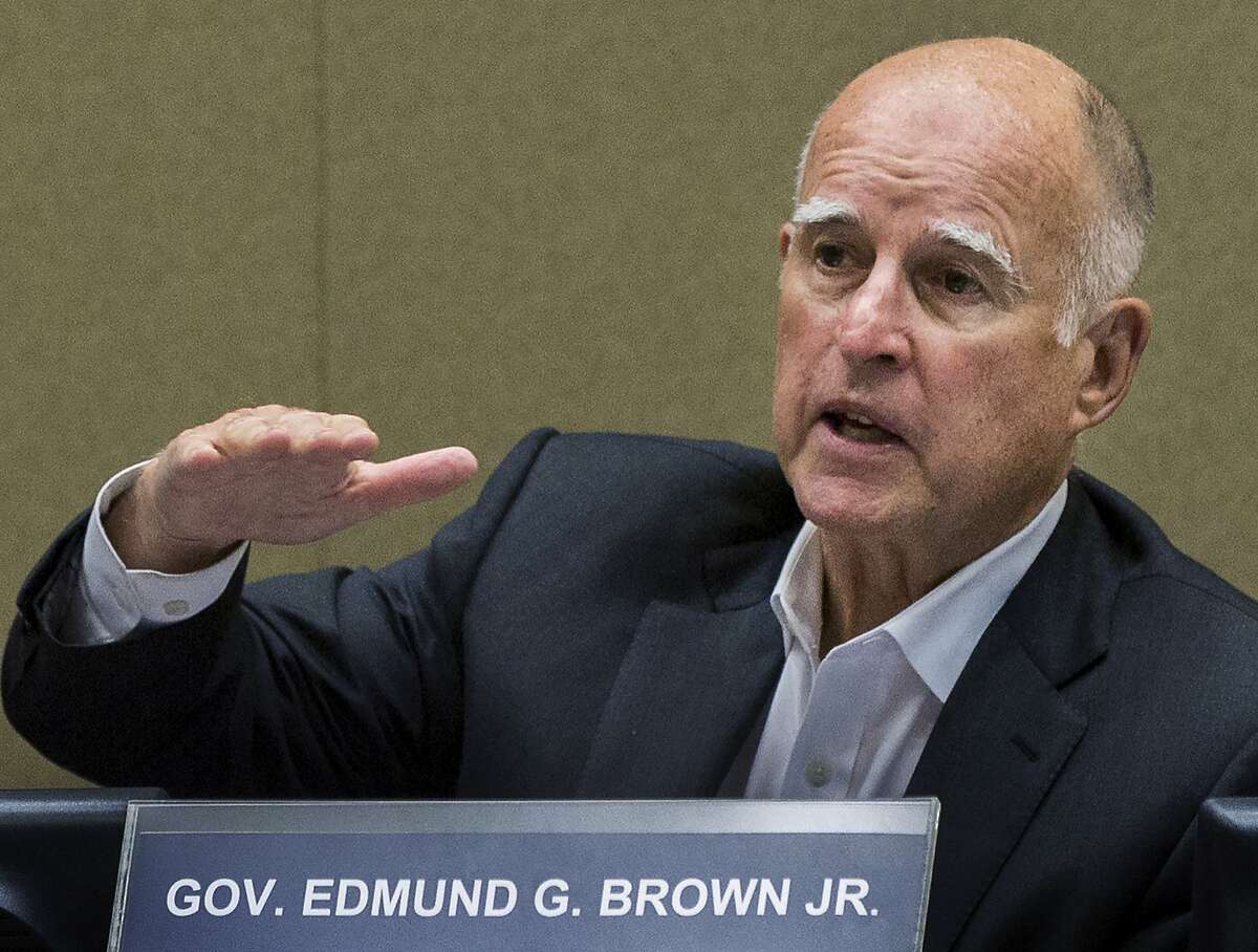 FILE - In this June 9, 2015, file photo, California Gov. Jerry Brown meets with board members of the Metropolitan Water District of Southern California in Los Angeles. California will become the fifth state in the nation to allow terminally ill patients to legally end their lives using doctor-prescribed drugs. Gov. Jerry Brown, a former Jesuit seminarian, announced, Monday, Oct. 5, 2015, he has signed a bill approved by state lawmakers after an emotional and deeply personal debate. (AP Photo/Damian Dovarganes, File)