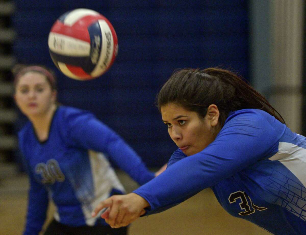FILE PHOTO: Abbott Tech's Raquel Diaz (31) digs out a serve in the girls high school volleyball match between Henry Abbott Technical and Immaculate high school on Wednesday afternoon, September 23, 2015, at Immaculate High School, in Danbury, Conn.
