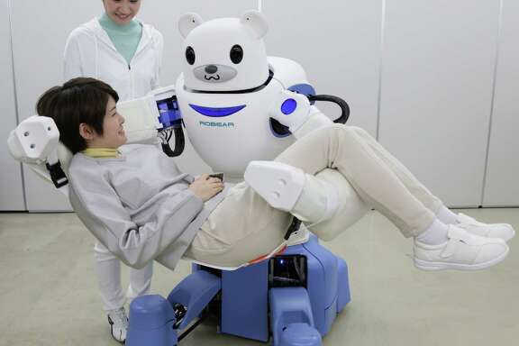 Judson ISD teacher Joseph Jacobson says anyone curious about the future of robotics should look to Japan. This picture taken on Feb. 23, 2015, shows a polar bear robot "Robear" lifting a woman for a demonstration in Nagoya, central Japan. The "Robear," developed by Riken Institute and Sumitomo Riko, has a polar cub-like face with big doey eyes, but packs enough power to transfer frail patients from a wheelchair to a bed or a bath.