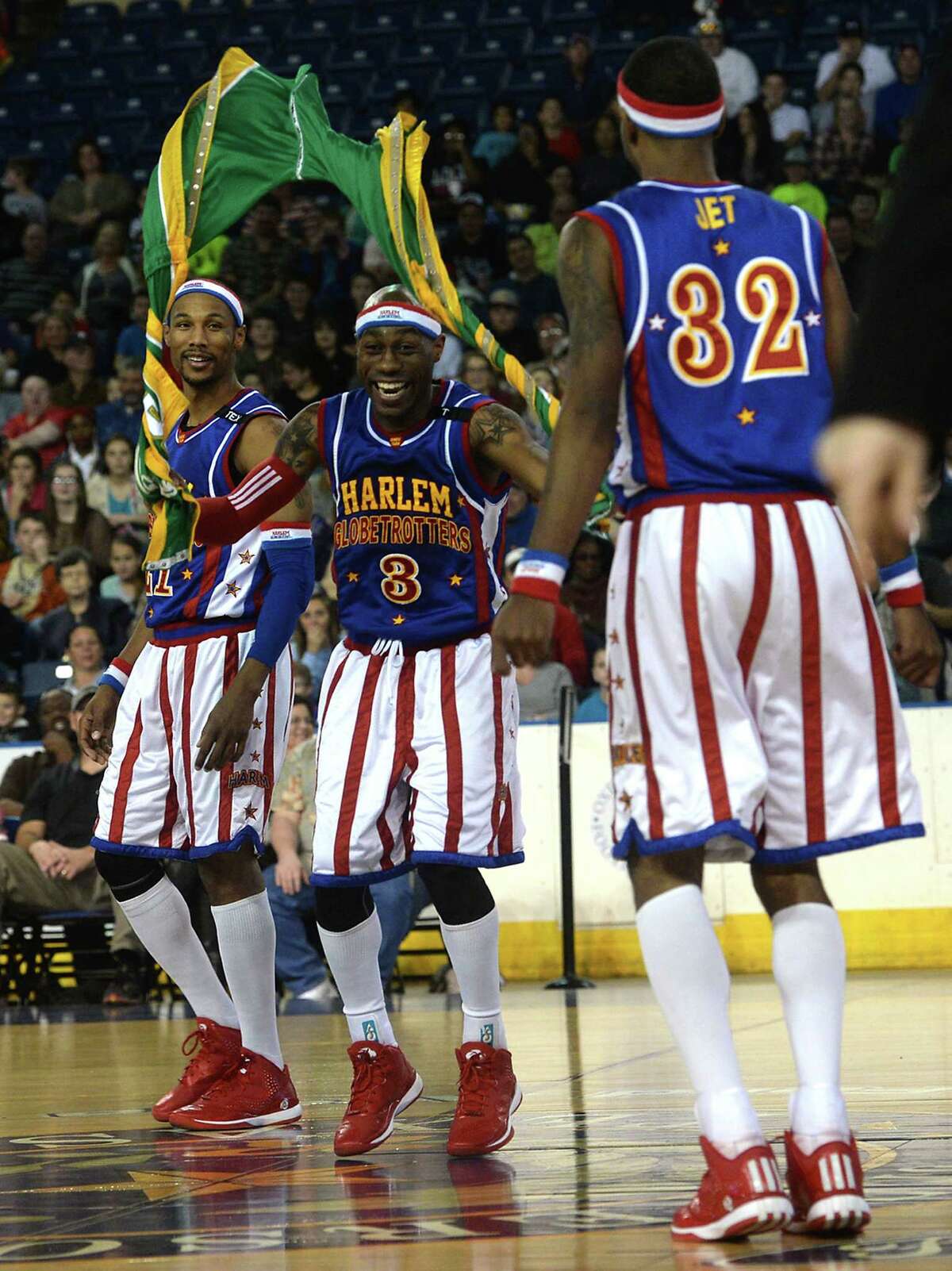The Harlem Globetrotters celebrate an early point scored against the Washington Generals during their show Wednesday night at Ford Park. Photo taken Wednesday, January 21, 2015 Kim Brent/The Enterprise