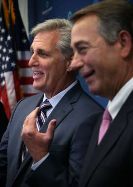 WASHINGTON, DC - SEPTEMBER 29:  U.S House Majority Leader Rep. Kevin McCarthy (R-CA) (L) and Speaker of the House Rep. John Boehner (R-OH) (R) share a moment as they speak to member of the media after a House Republican Conference meeting September 29, 2015 at the U.S. Capitol in Washington, DC. House Republicans met to discuss GOP agenda including the government funding bill.  (Photo by Alex Wong/Getty Images)