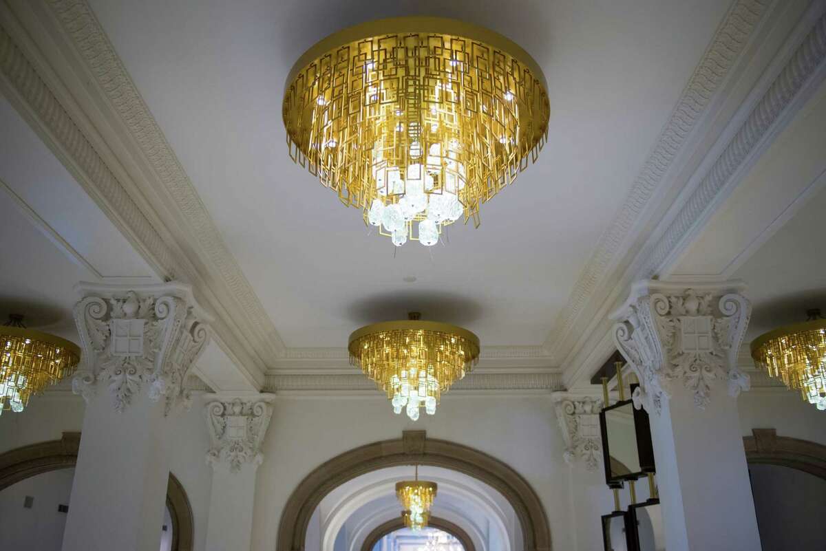 Chandeliers in the main entrace boast craftsmanship by Voss Metals, a four-generation San Antonio metal work company. At the St. Anthony Hotel in downtown San Antonio on Friday, October 2, 2015. The hotel was recently renovated after being purchased by new owners in 2012. The hotel will have a grand reopening Nov. 19.