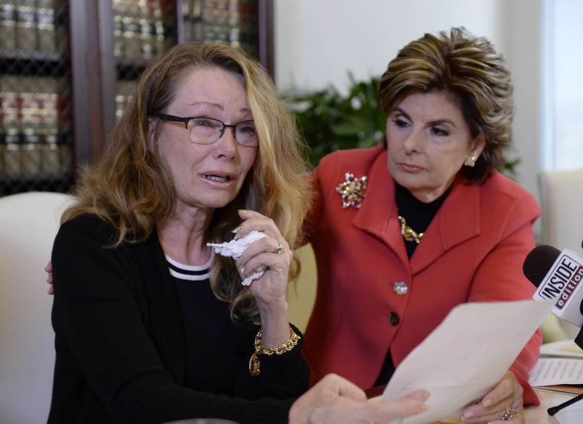 Sharon Van Ert (L) one of three new alleged sexual assault victims of comedian Bill Cosby reacts during a news conference with attorney Gloria Allred September 30, 2015, in Los Angeles, California. Cosby has been accused of sexual assault by over 30 women. (Photo by Kevork Djansezian/Getty Images)