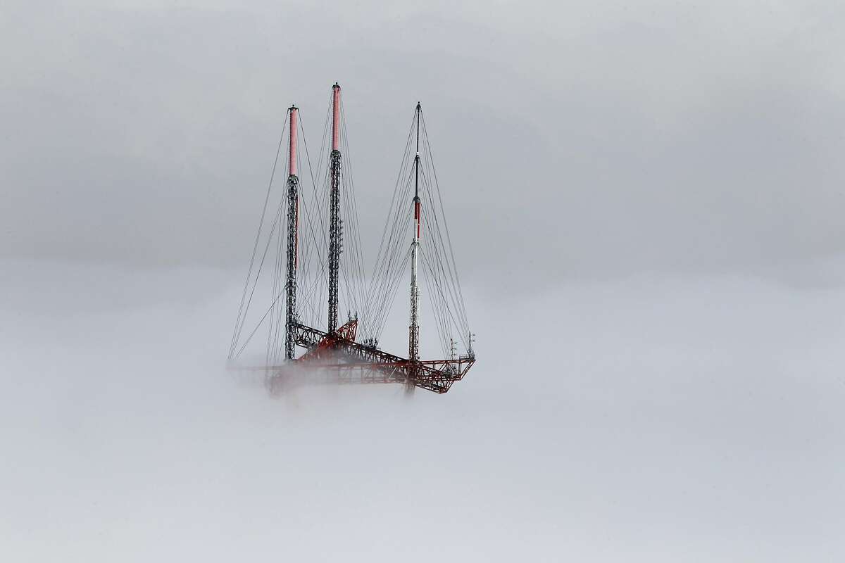 Sutro Tower emerges from a low layer of fog in San Francisco, Calif. on Friday, Sept. 28, 2012.