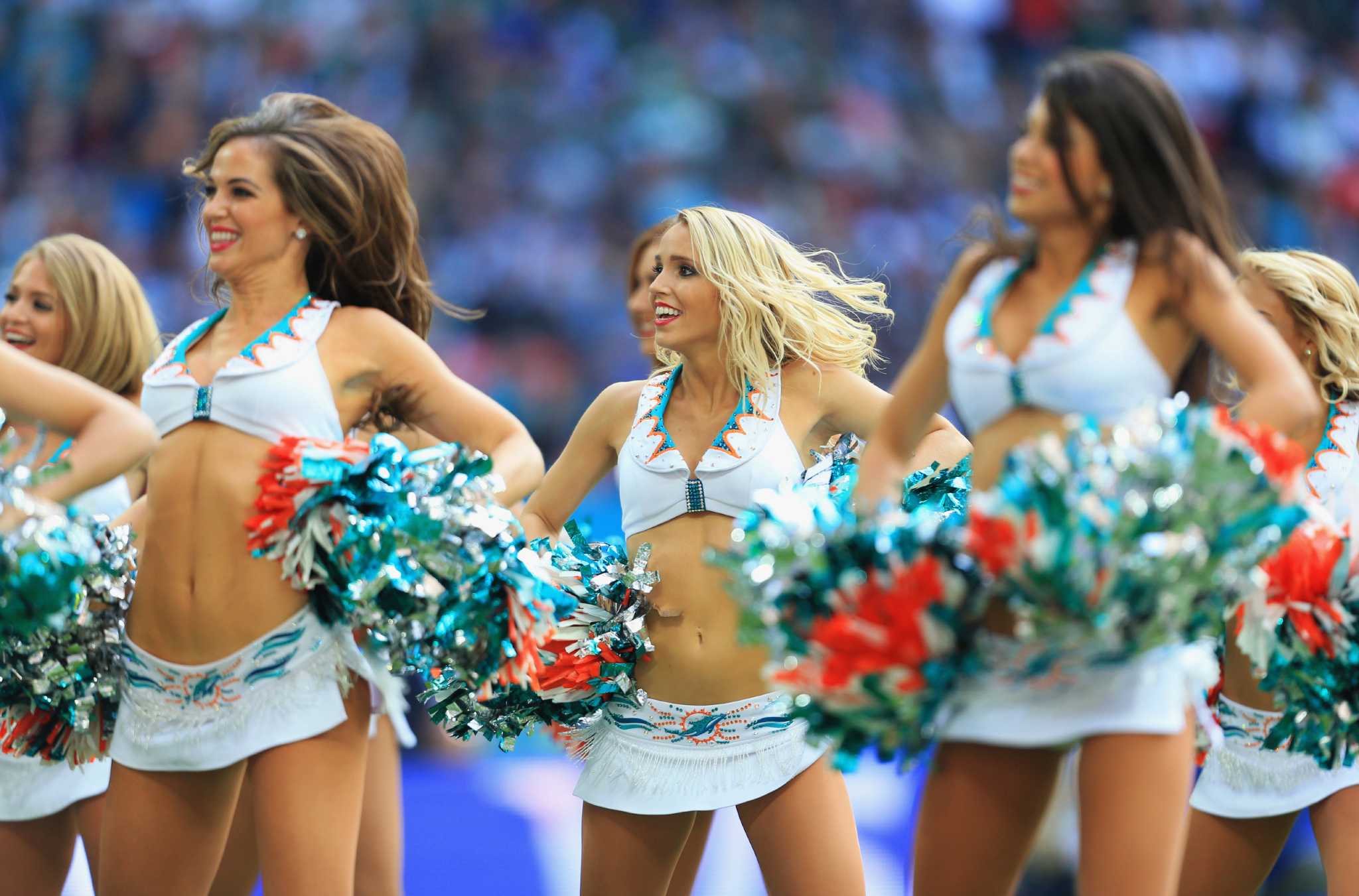 Miami Dolphins Cheerleaders entertain the crowd in Christmas attire during  the first half against the Buffalo Bills at Sun Life Stadium on December  23, 2012 in Miami, Florida. The Miami Dolphins beat