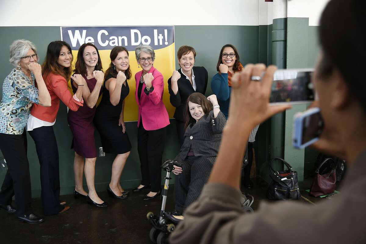 Judy Patrick, Equal Rights Advocates (ERA), fron left, Mariko Yoshihara, CELA, Noreen Farrell, ERA, Jennifer Reisch, ERA, Sen. Jackson, and in the wheelchair is Rachael Langston of Legal Aid Society - Employment Law Centerduring a bill signing ceremony held in the Craneway Pavilion at Rosie the Riveter-WWII Home Front National Historical Park in Richmond, CA Tuesday, October 6, 2015.