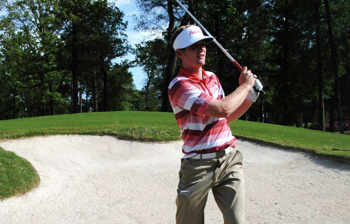 Curtis Reed hits out of a bunker in 2013 as a member of the University of Houston golf team,
