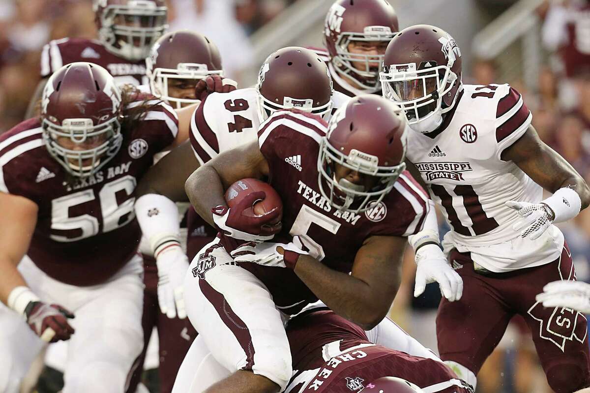 Tra Carson of the Texas A&M Aggies rushes against the Mississippi State Bulldogs in the first quarter on Oct. 3, 2015 at Kyle Field in College Station.