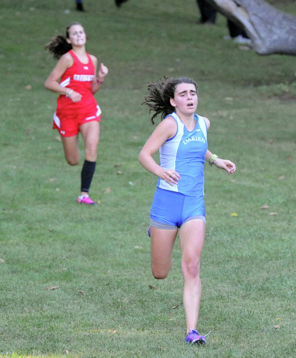 At right, Darien's Sarah LeHan came in second during the girls high school cross country meet at Greenwich Point, Greenwich, Conn., Tuesday, Oct. 6, 2015.