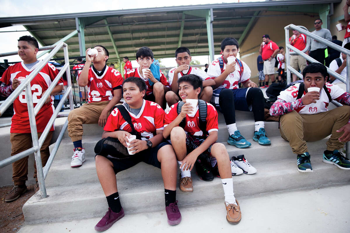 Members of the Irving Middle School football team gather Tuesday Oct. 6, 2015 during National Night Out at West End Hope in Action.