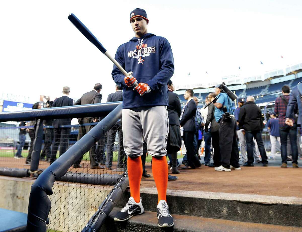 Houston Astros right fielder George Springer (4) on the steps of the dugout during batting practice before the start of the American League Wild Card game at Yankee Stadium on Tuesday, Oct. 6, 2015, in New York. ( Karen Warren / Houston Chronicle )