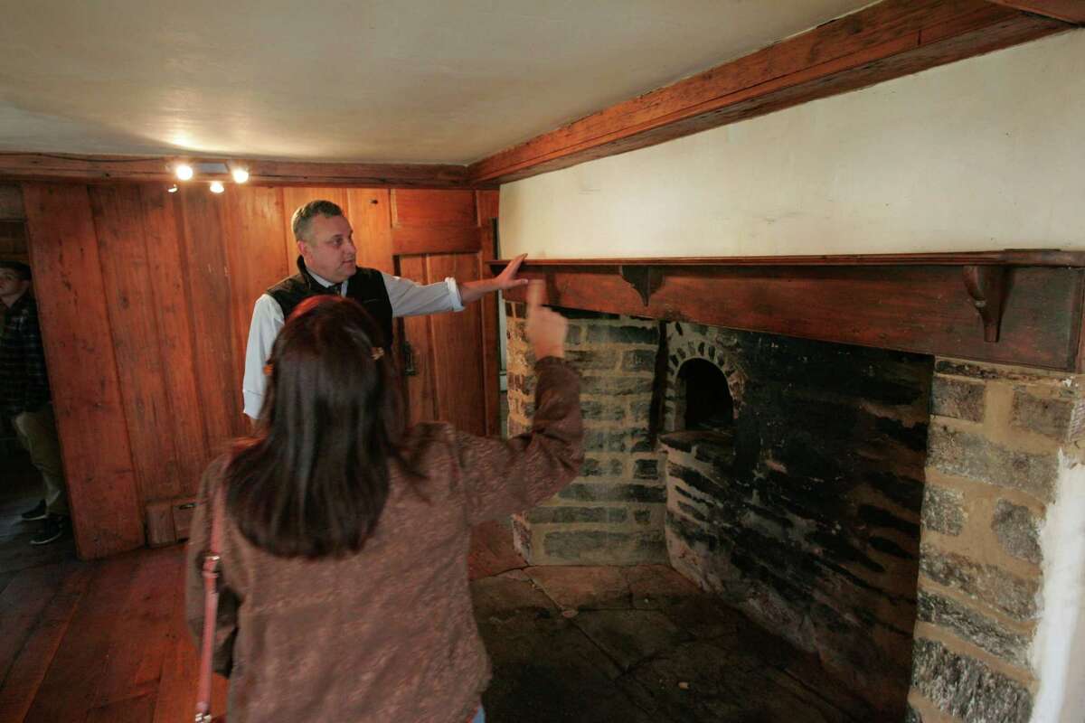 Daniel Mackay, executive director of the Connecticut Trust for Historic Preservation, is given a tour of the Hoyt Barnum House on Bedford Street.