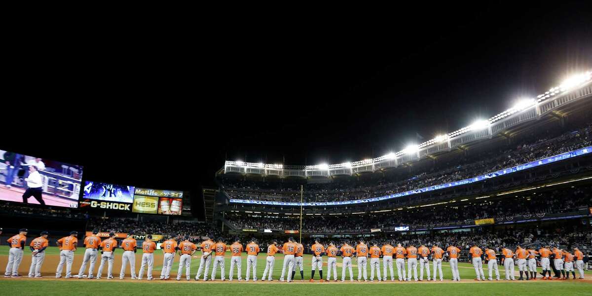 The Astros line the third-base chalk during introductions before their American League wild-card victory over New York at Yankee Stadium on Tuesday night.