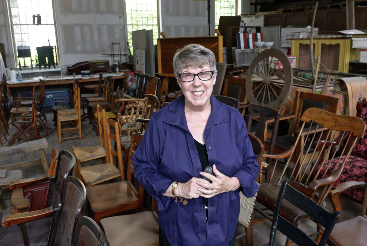 Pat Rist, president of the Bethel Historical Society, stands in a furniture storage area of the building on Main Street on Thursday, Sept. 3, 2015, in Bethel, Conn.