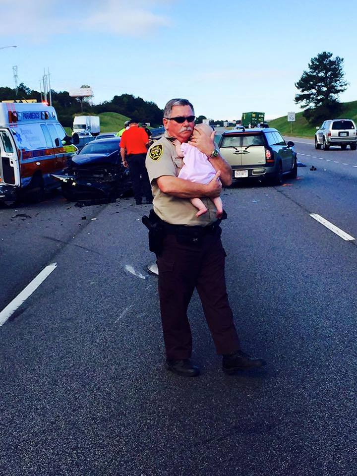 Photo of deputy comforting baby after car crash goes viral