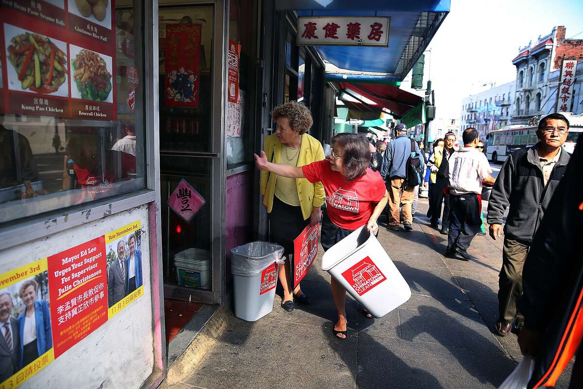 SF supervisor Julie Christensen with director Rita Mah of the Chinese Newcomers Service Cente visit storeowners in Chinatown in San Francisco, Calif., on Tuesday, October 6, 2015. Trashcans will be placed in front of merchants' stores to increase pedestrian access to trash receptacles and decrease illegal dumping as part of the Keep Chinatown Clean program.