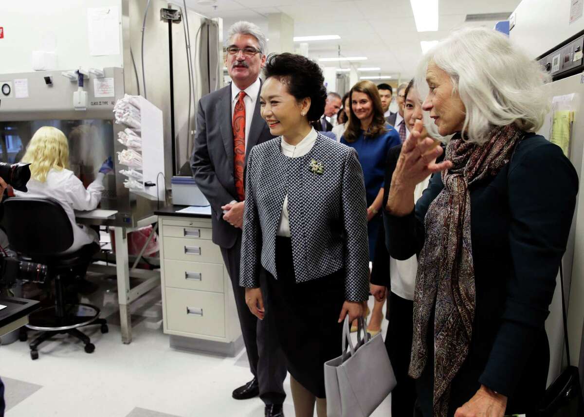 Peng Liyuan, center, the wife of Chinese President Xi Jinping, tours an HIV vaccine research lab Sept. 23 at the Fred Hutchison Cancer Research Center, which is one of the labs that says the tissues from fetuses have been crucial to the study of diseases and disorders. ﻿﻿
