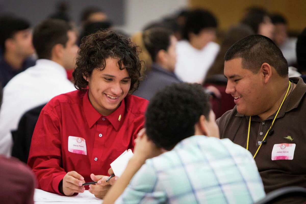 Steve Flores, left, and James Garcia, right, take notes and participate in the LOFT STEM Leadership Symposium at the University of Houston, on Wednesday, which was co-sponsored by the U.S> Army.