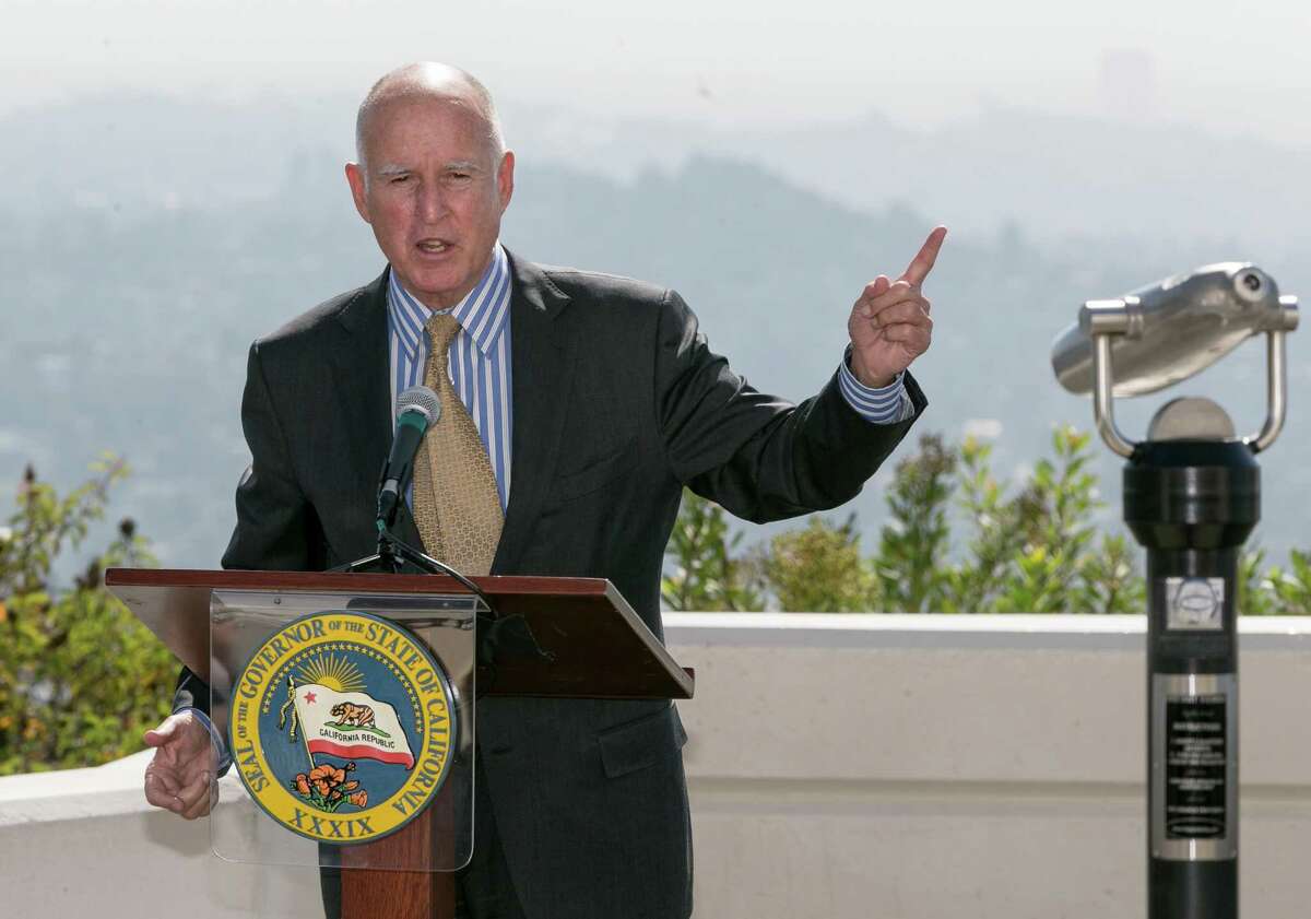 California Gov. Jerry Brown speaks before signing a bill to combat climate change by increasing the state's renewable electricity use to 50 percent and doubling energy efficiency in existing buildings by 2030 at a ceremony at the Griffith Observatory in Los Angeles on Wednesday, Oct. 7, 2015. (AP Photo/Damian Dovarganes)