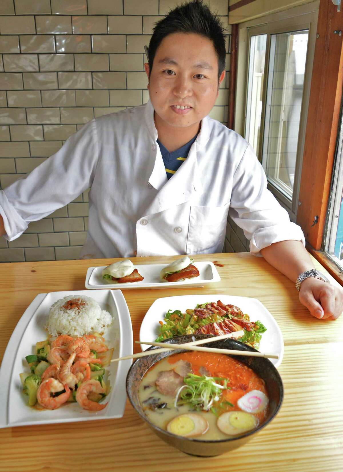 Dave Zehng with a sampling of fare at his Tanpopo ramen and sake restaurant on Broadway Saturday Oct. 3. 2015 in Albany, NY. (John Carl D'Annibale / Times Union)