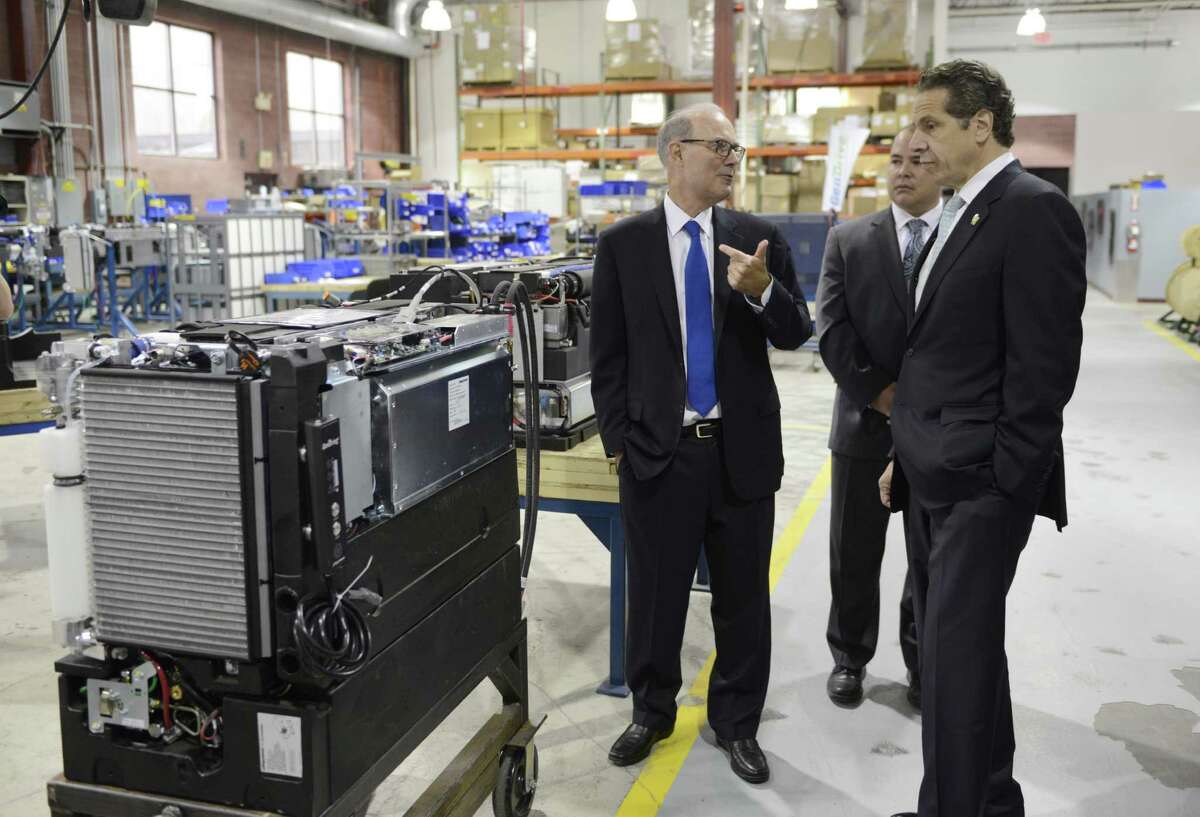 Plug Power CEO Andy Marsh, left, gives Gov. Andrew Cuomo a factory tour Wednesday, Oct. 8, 2014, at Plug Power in Colonie, N.Y., where the governor was endorsed by the state Business Council. (Will Waldron/Times Union)