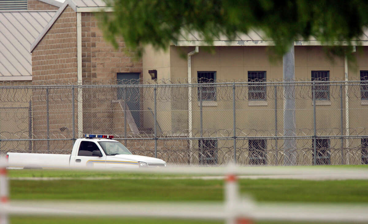 A prison security vehicle patrols the fence line at the Federal Correctional Institution near Three Rivers in 2008.