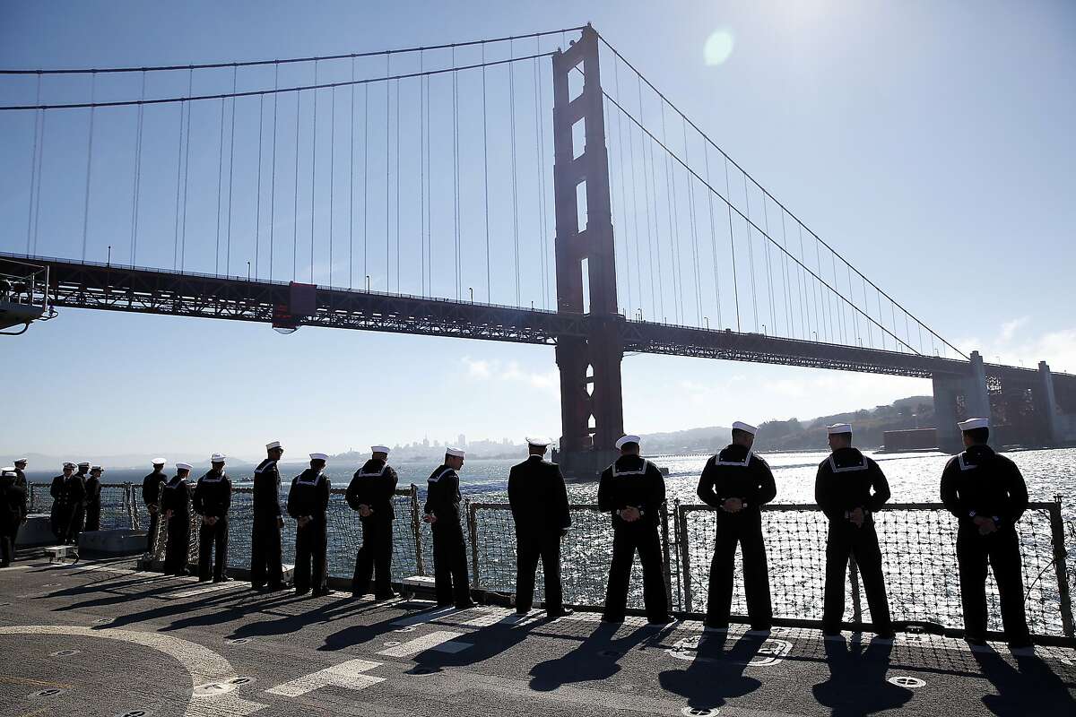 The USS Cape St. George passes under the Golden Gate Bridge during the Fleet Week Parade of Ships in San Francisco, Calif., on Friday, October 9, 2015.