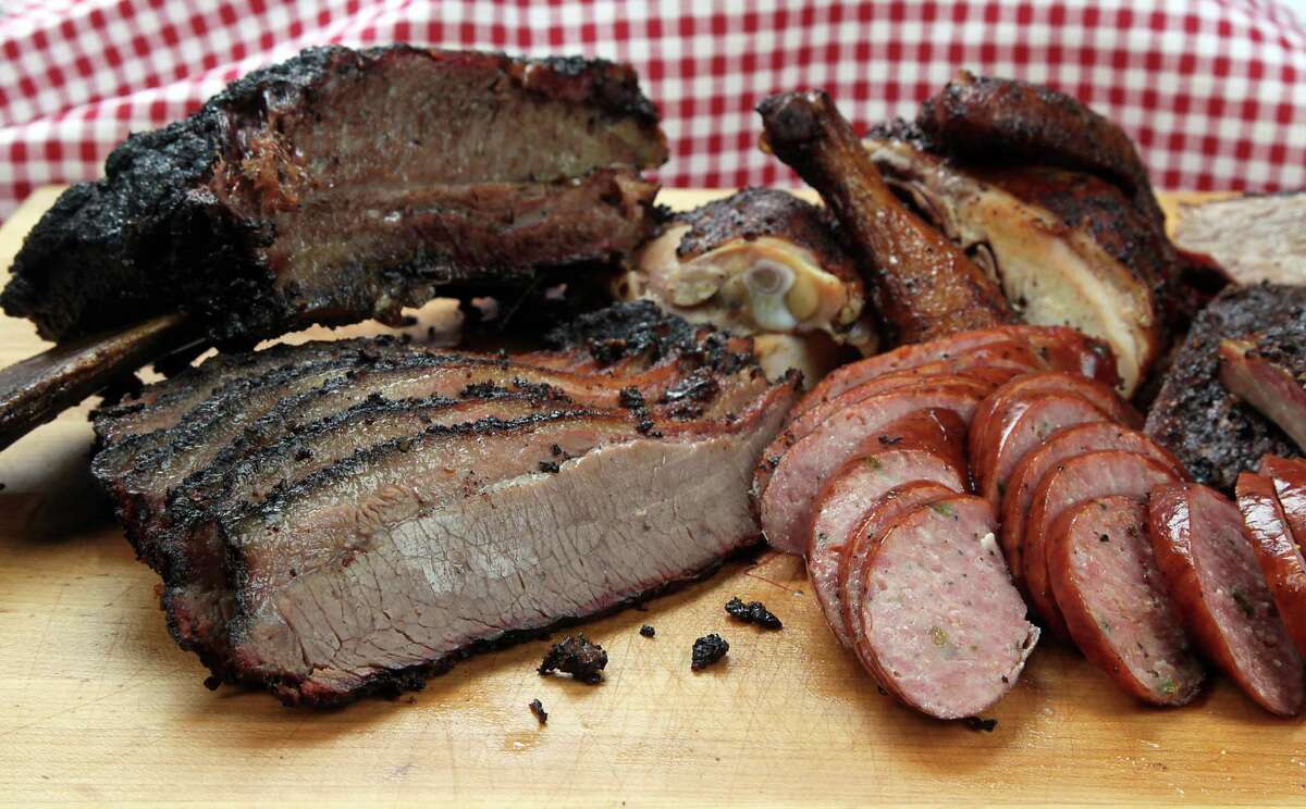 Barbecue brisket, sausage, chicken and beef rib from The Brisket House restaurant in Houston. ( James Nielsen / Houston Chronicle )