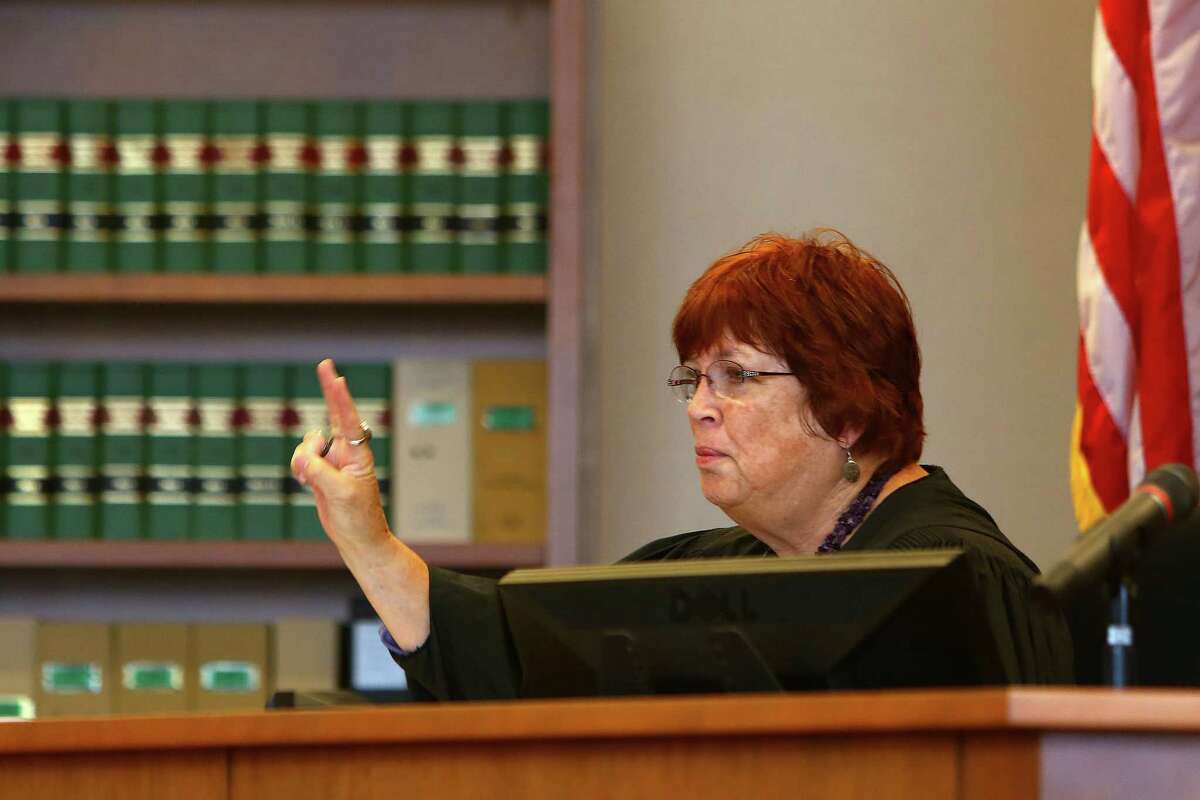 King County Superior Court Judge Laura Middaugh speaks to the lawyer for the plaintiff during a summary judgment hearing after a landlord sued his ex-tenant over a Yelp review.