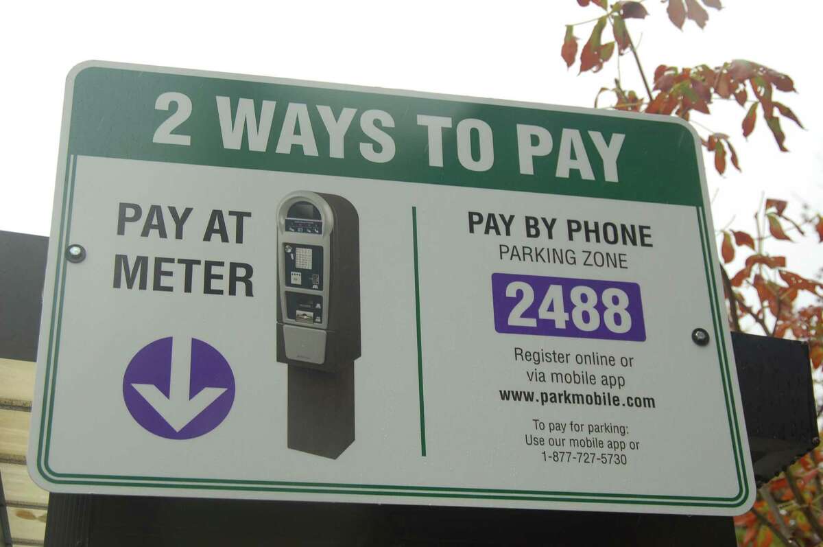 New signs at local Greenwich parking lots alert drivers to the advantages of parking by phone.