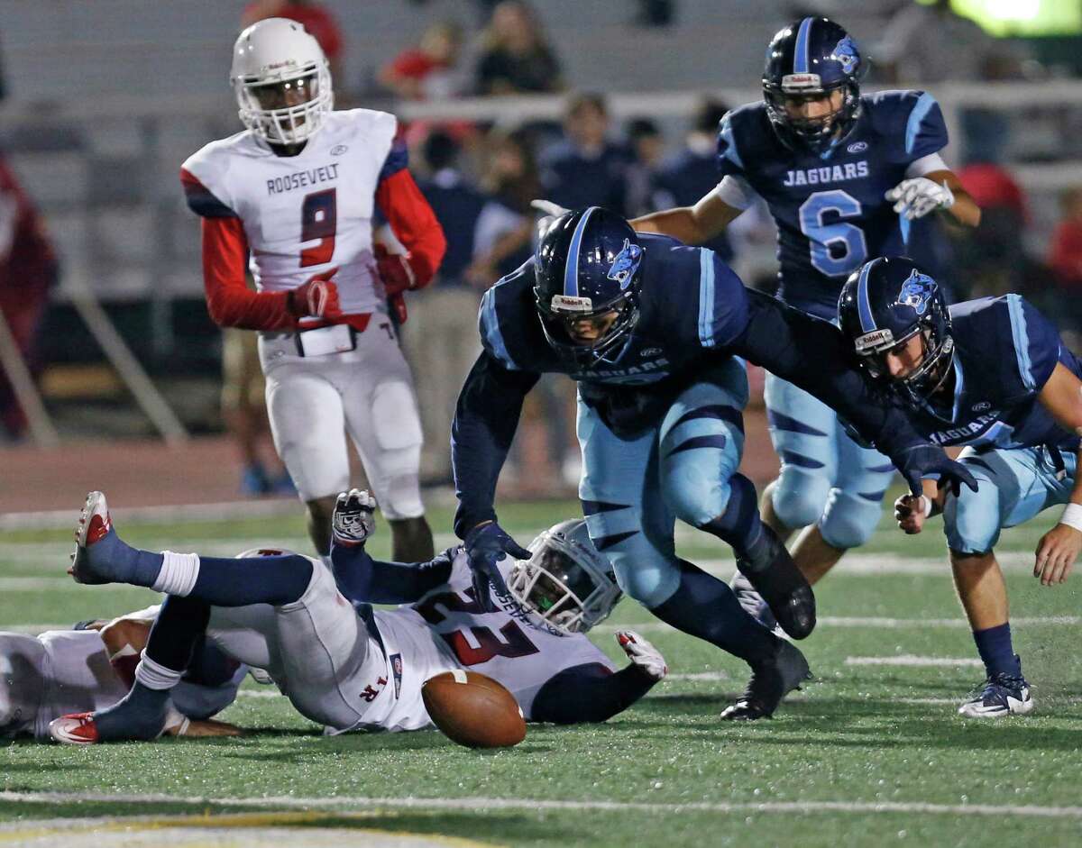 Roosevelt Joshua Morgan watches his fumble being recovered eventually by Johnson's Jack Scarborough, not in frame. District 26-6A high school football game between Roosevelt and Johnson at Comalander Stadium on Friday, October 9, 2015.