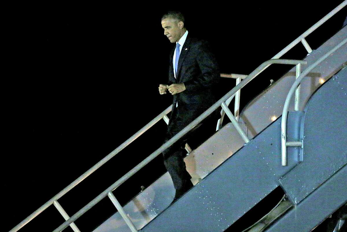 President Barack Obama steps off Air Force One after landing at San Francisco International Airport in San Francisco, California, on Friday, Oct. 9, 2015. 