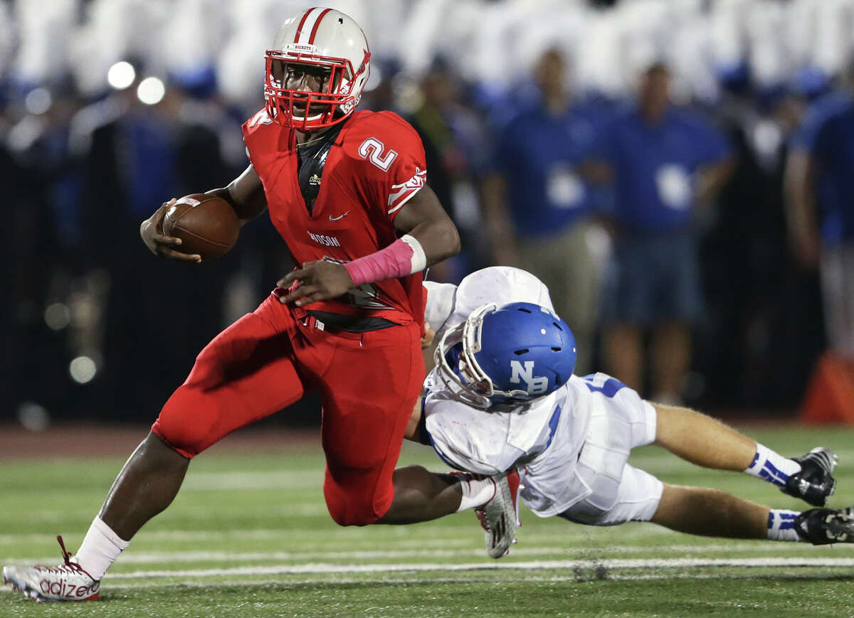 Judson quarterback Julon Williams gets away from New Braunfels would-be tackler Kolton Meneley during the Rockets’ victory Friday night at Rutledge Stadium.