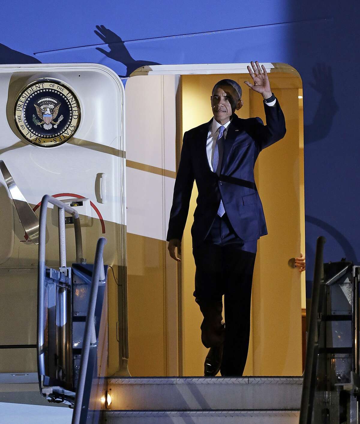 President Barack Obama waves as he exits Air Force One on Friday, Oct. 9, 2015, in San Francisco.  