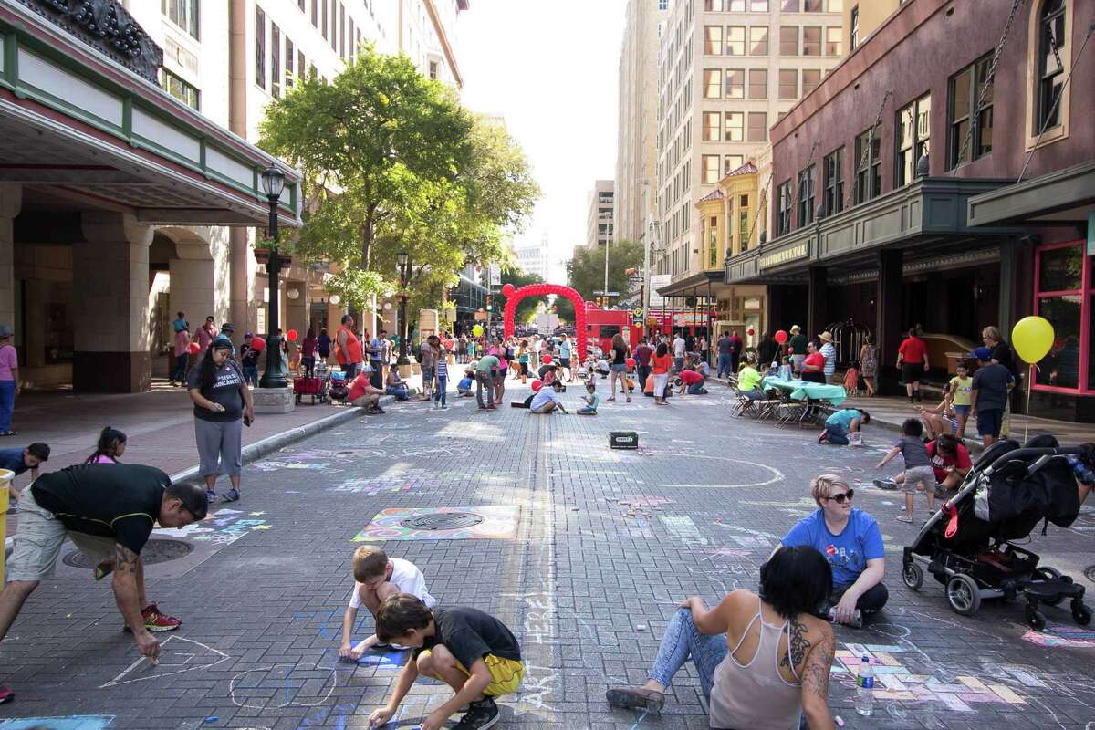 Houston Street was transformed into an evolving work of art on Saturday, Oct. 10, 2015, as area artists and residents converged, with chalk in hand, for Artpace’s Chalk It Up.