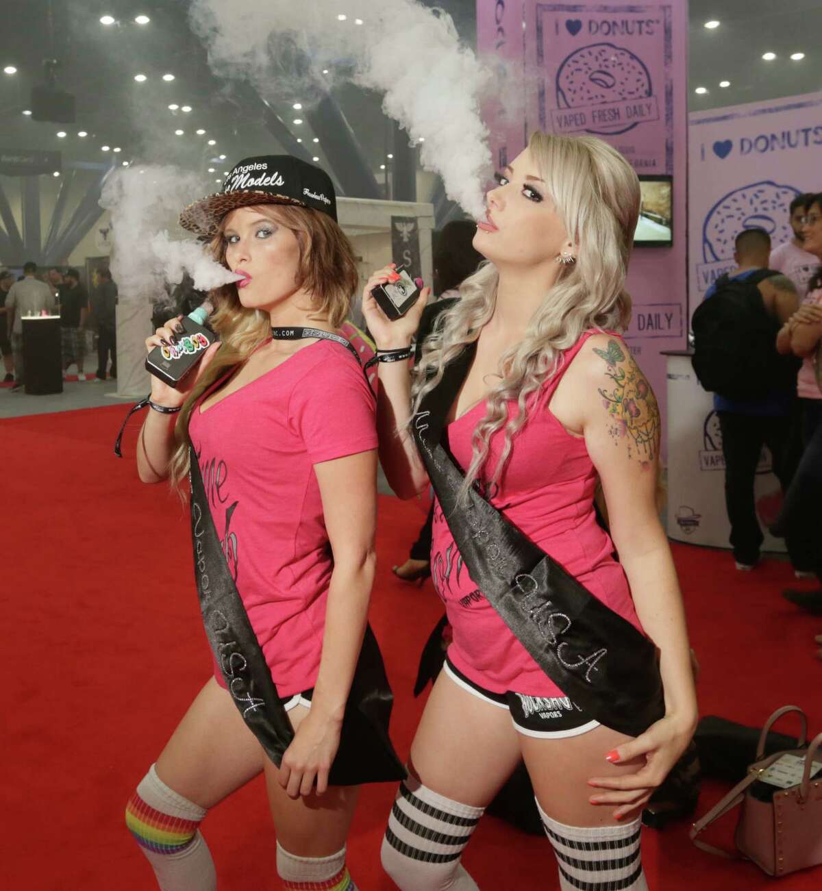Fans pose for a photo at the Vape Summit IV, at the George R. Brown Convention Center, Saturday, Oct. 10, 2015, in Houston.