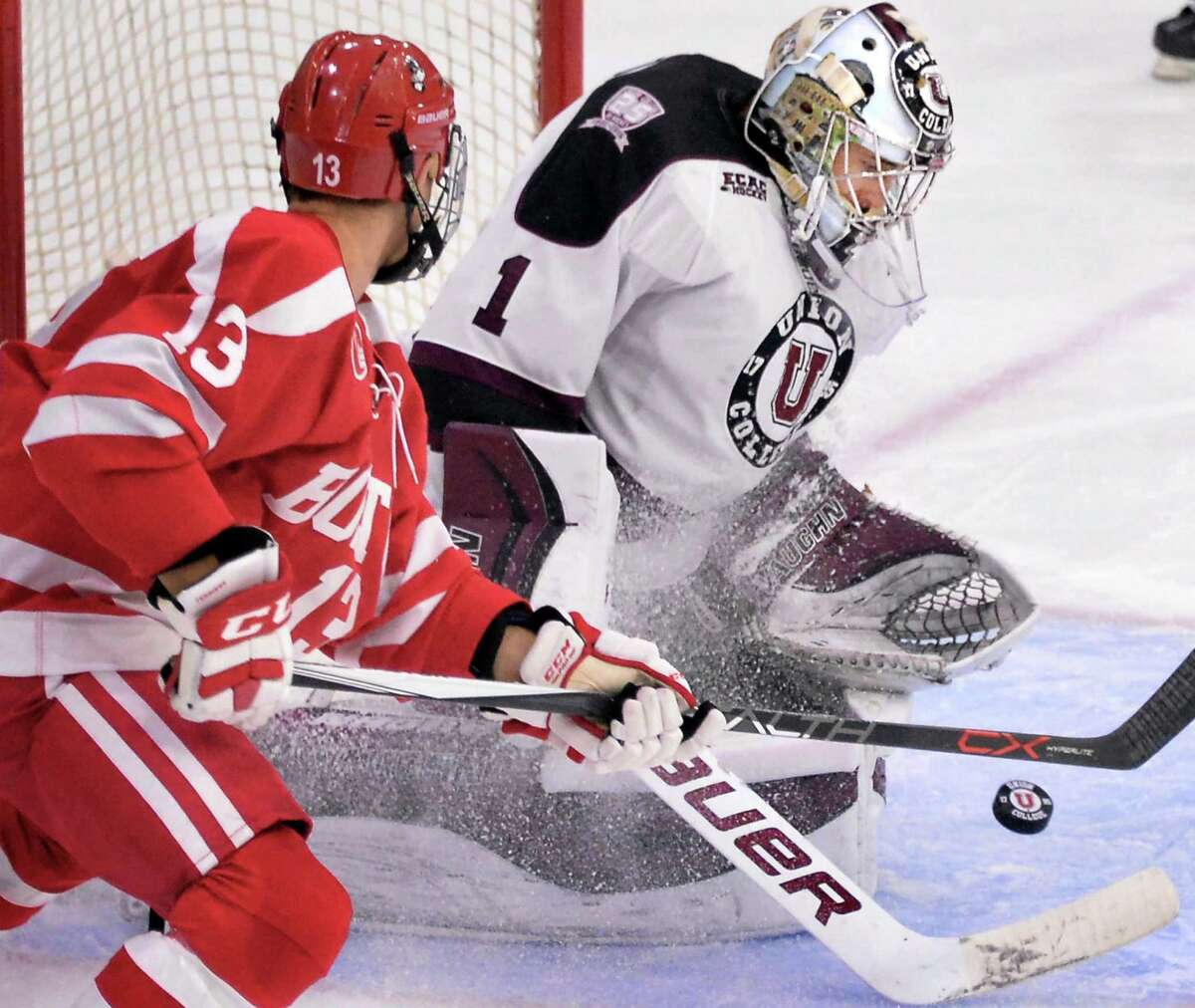 Union goalie Alex Sakellaropoulos stops a shot by Boston University's #13 Nikolas Olsson, left, during Saturday's game at Messa Rink Oct. 10, 2015 in Schenectady, NY. (John Carl D'Annibale / Times Union)