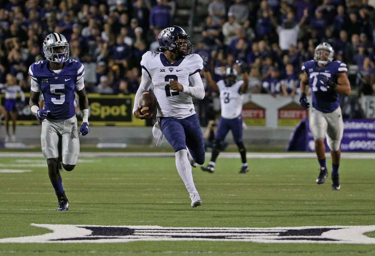 TCU quarterback Trevone Boykin outraces Kansas State defenders on a 69-yard touchdown run in the fourth quarter. Boykin accounted for 425 yards of total offense and four TDs.