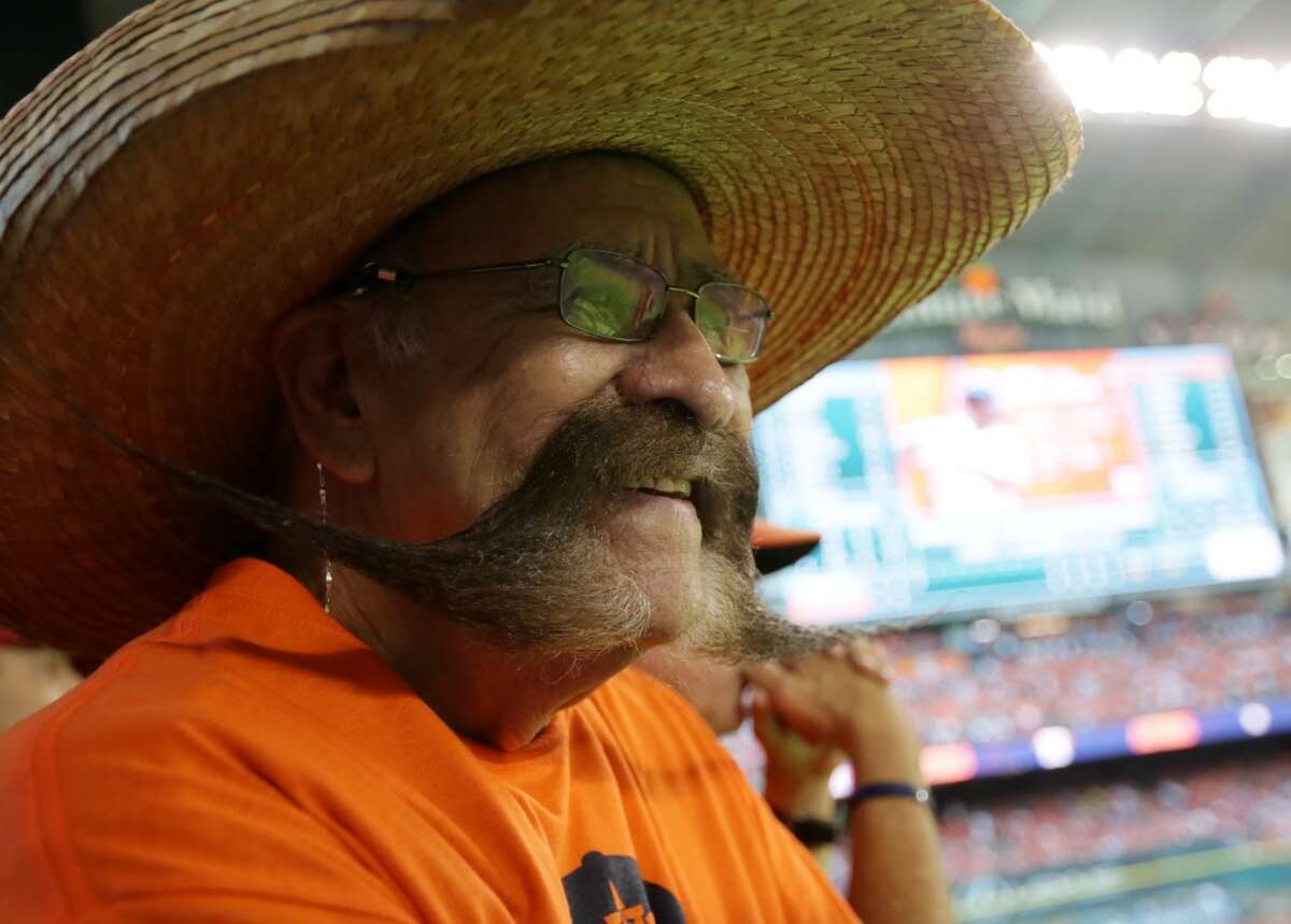 This Astros fan's mustache is at least three times as wide as his face