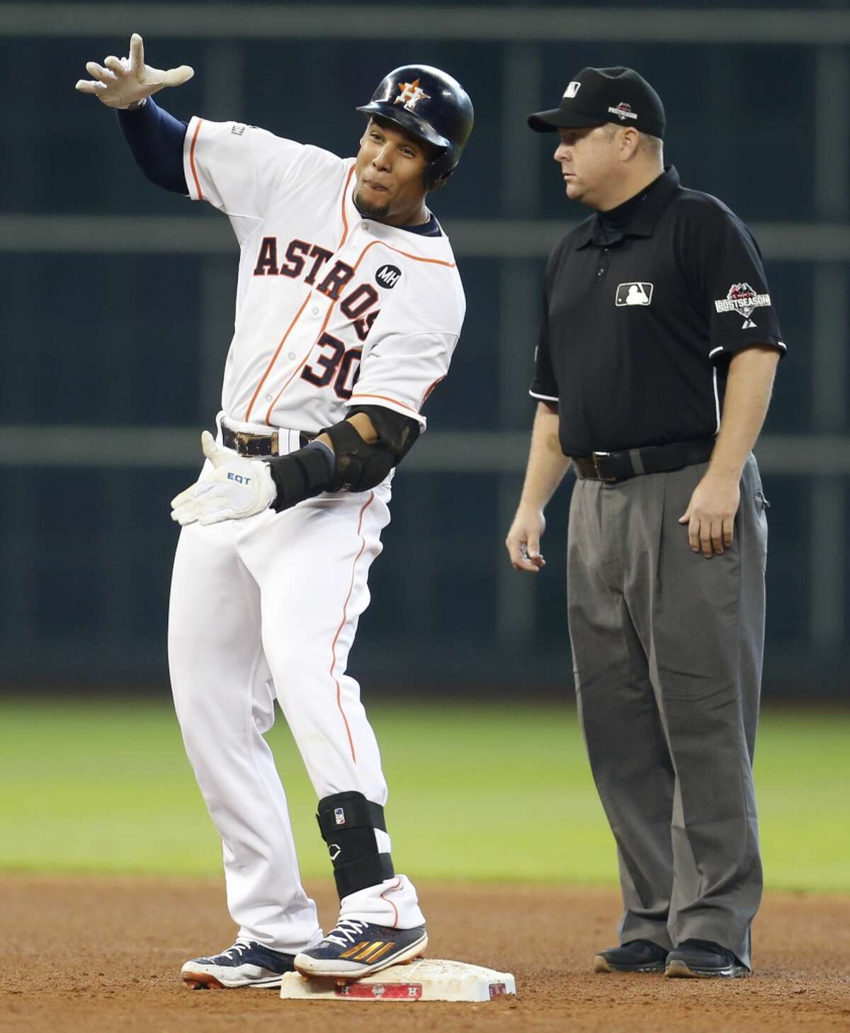 Houston Astros center fielder Carlos Gomez (30) reacts at second base after singling and going to second on a throw during the seventh inning of Game 4 of the American League Division Series against the Kansas City Royals at Minute Maid Park on Monday, Oct. 12, 2015, in Houston. ( Karen Warren / Houston Chronicle )